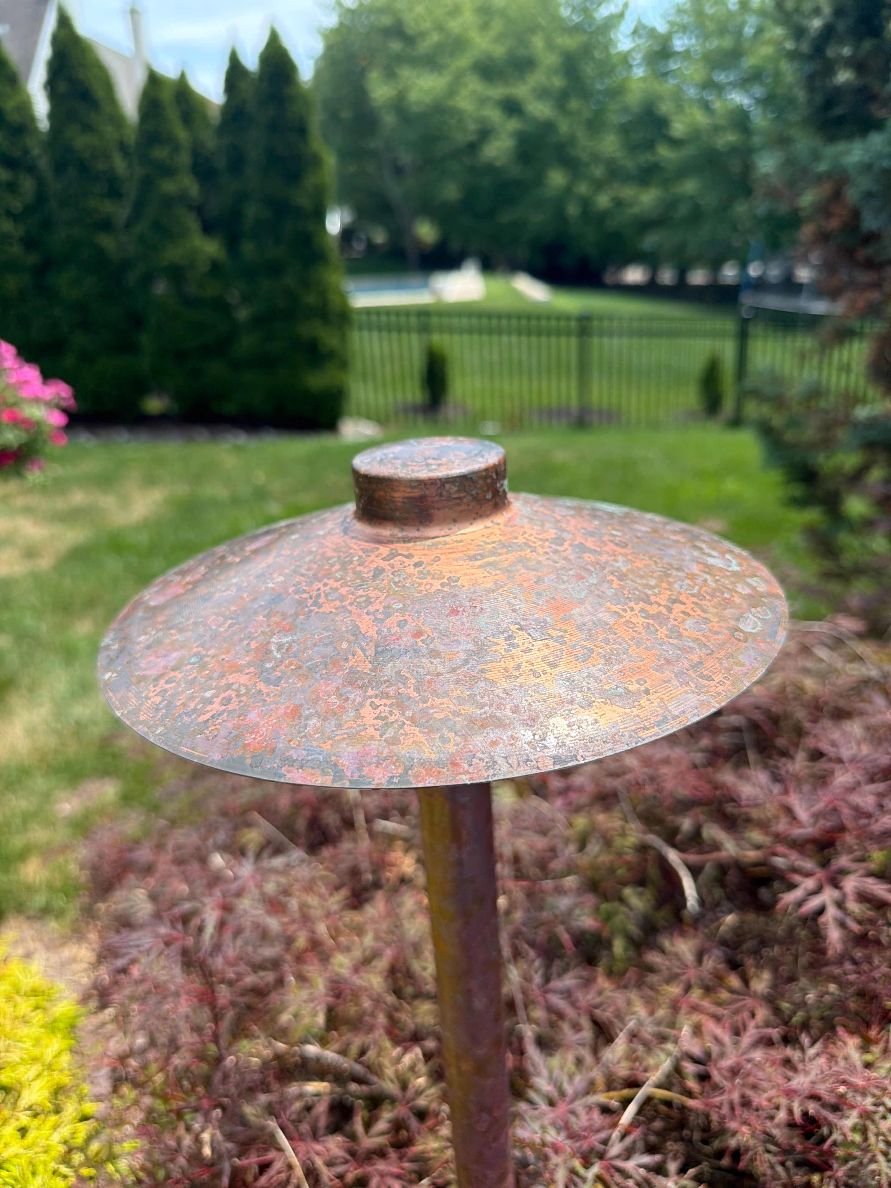 Existing outdoor lighting fixture during patina removal