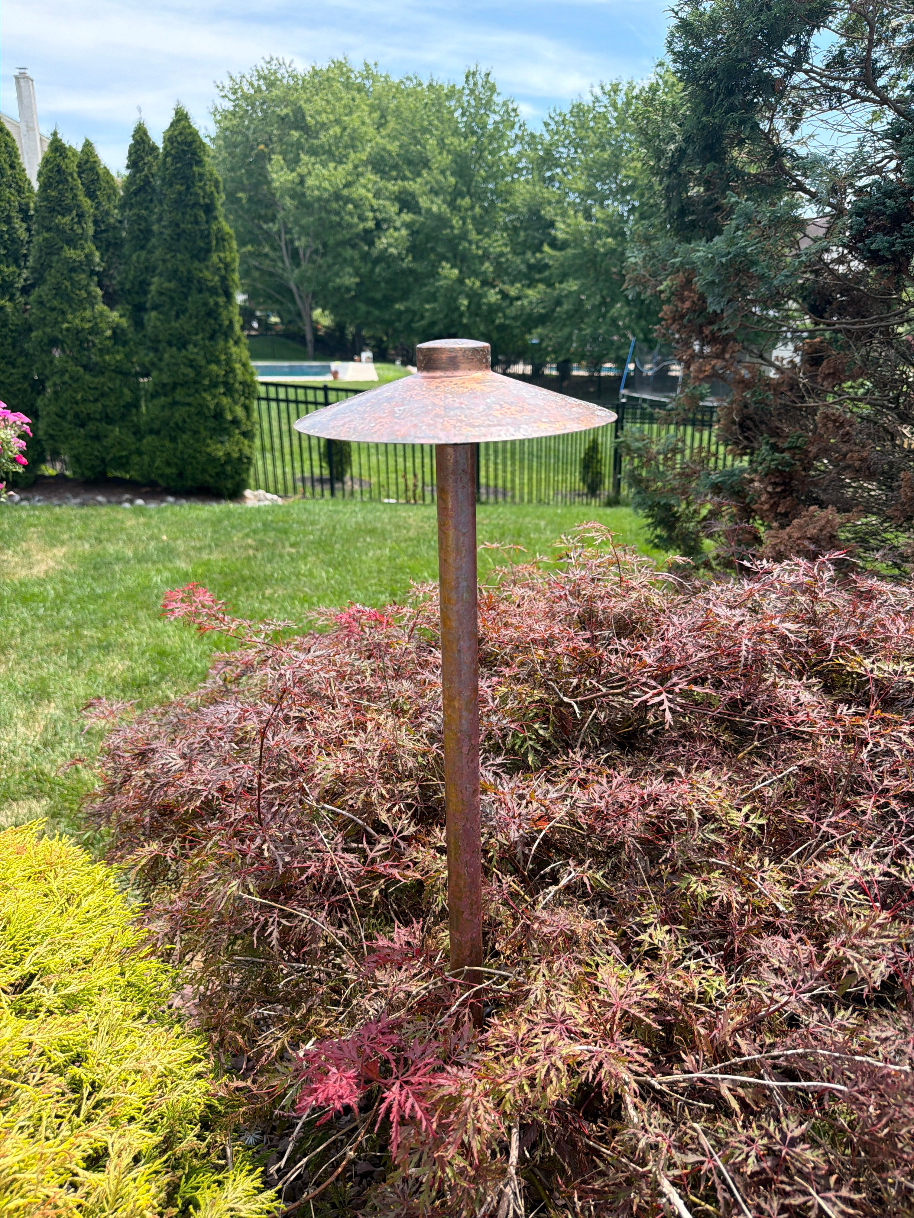 Restored existing outdoor lighting fixture after patina removal