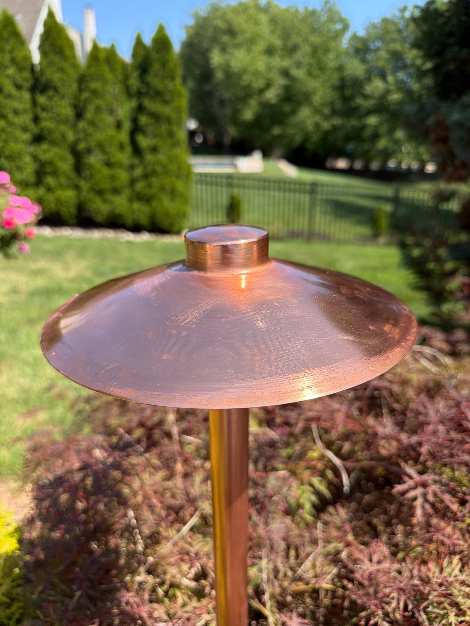 Existing outdoor lighting fixture before patina removal